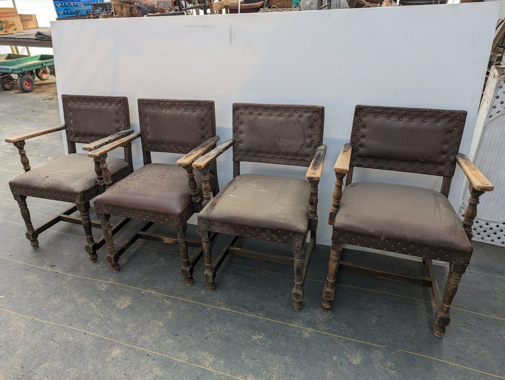 Four Leather Covered Chairs