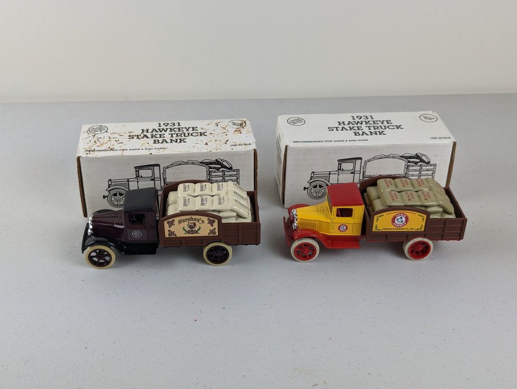 (2) 1931 Hawkeye Stake Bank Trucks 