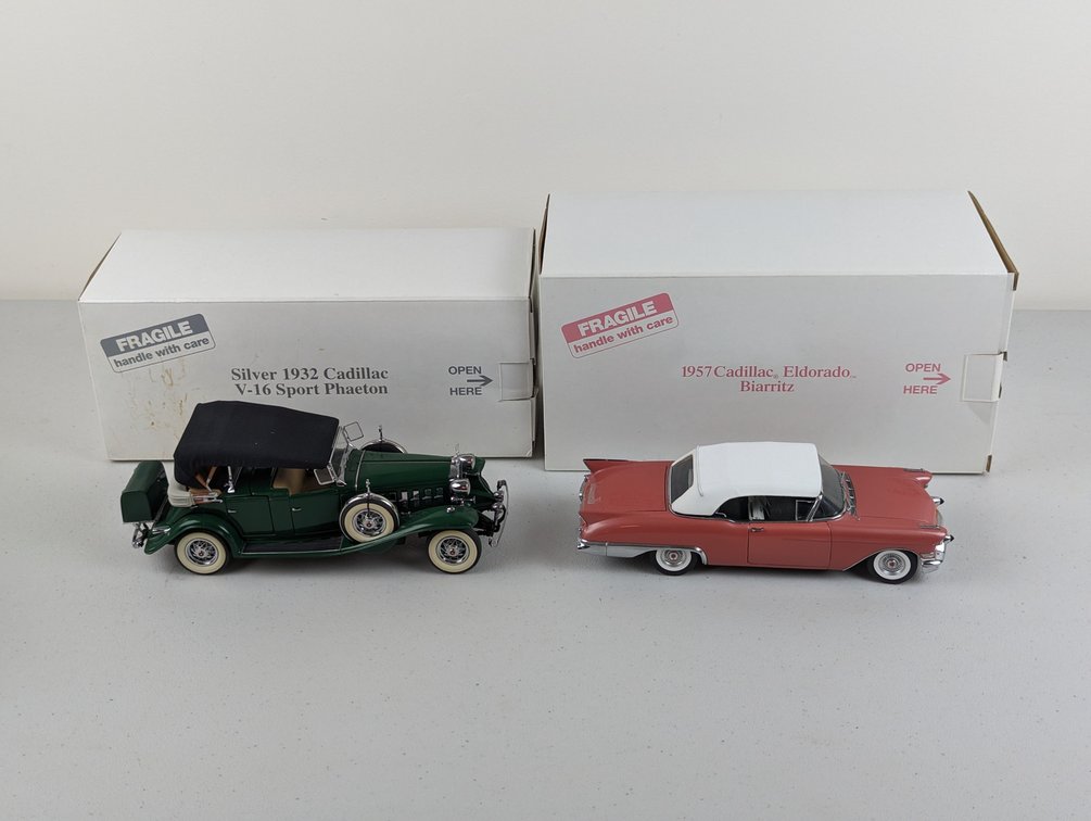 (2) Danbury Mint Cadillacs
