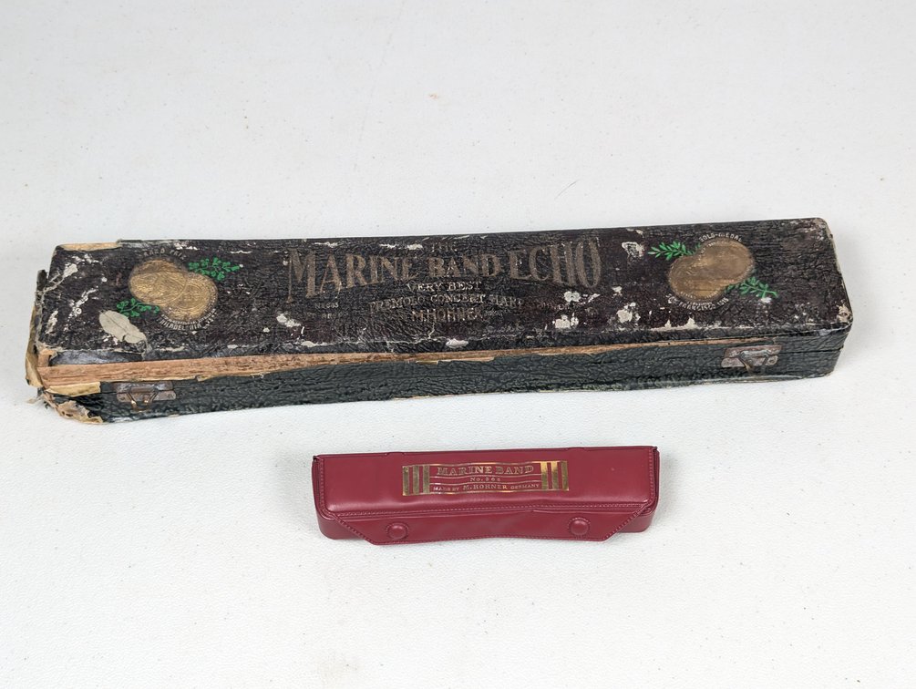 Two Hohner Echo Harmonicas