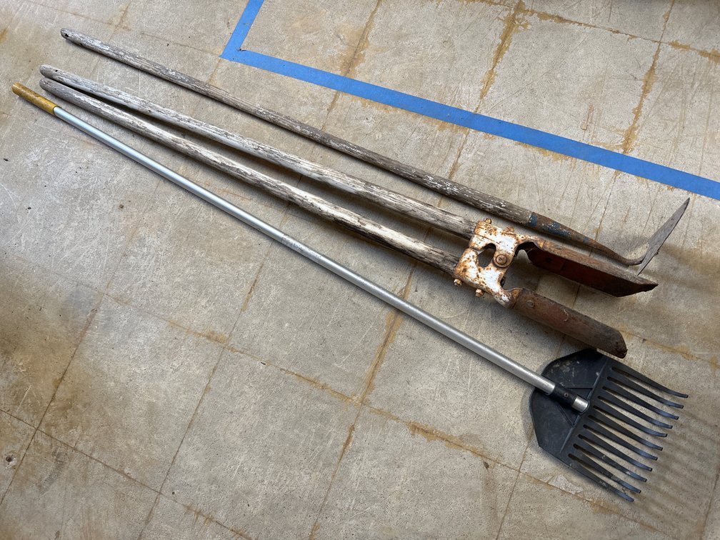 Rake, Posthole Digger, and Hoe