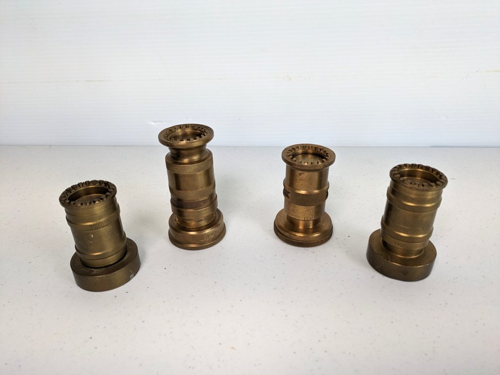 Four Vintage Brass Fire Nozzles
