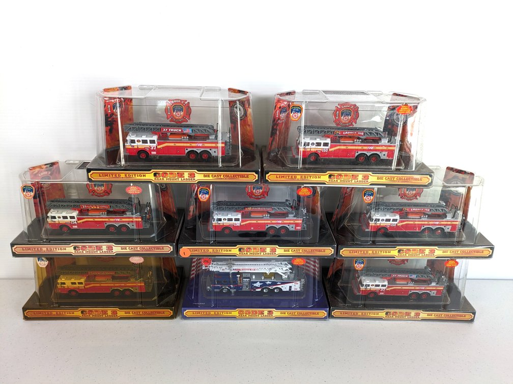 (8) Code 3 Rear Mount Ladder Trucks 