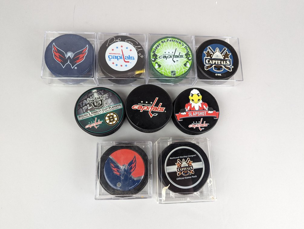 Nine Capitals Hockey Pucks
