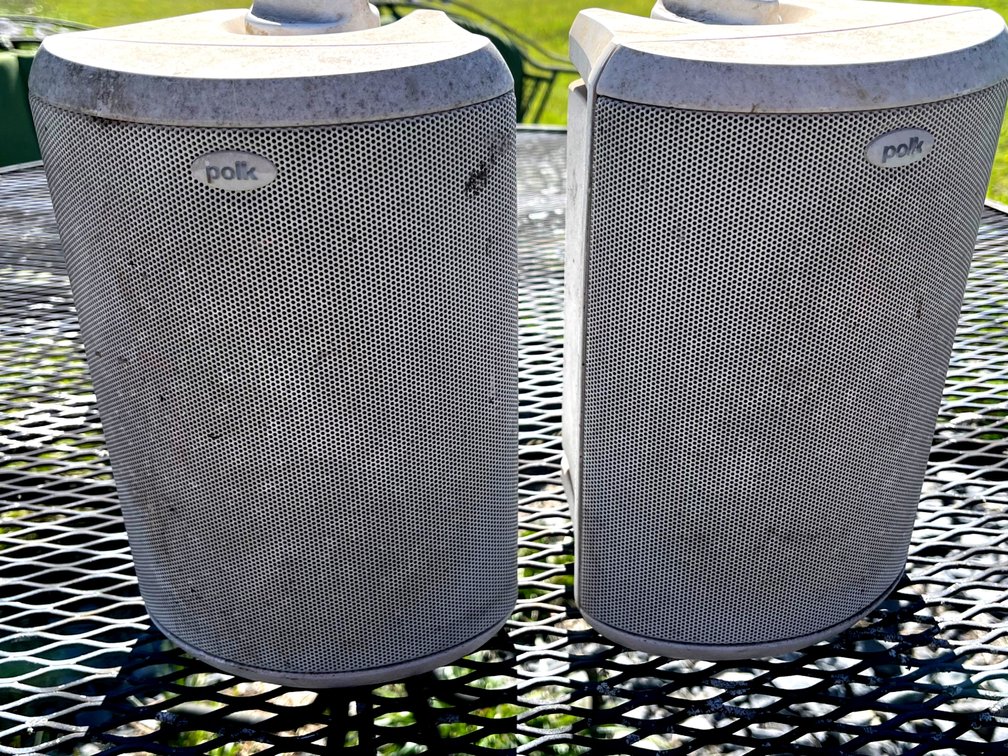 Two Outdoor Speakers with Attached Mounting Brackets