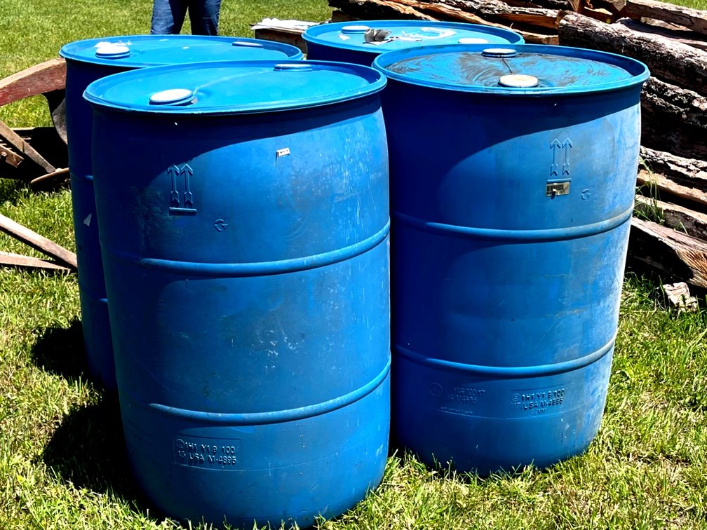 Four Plastic Barrels