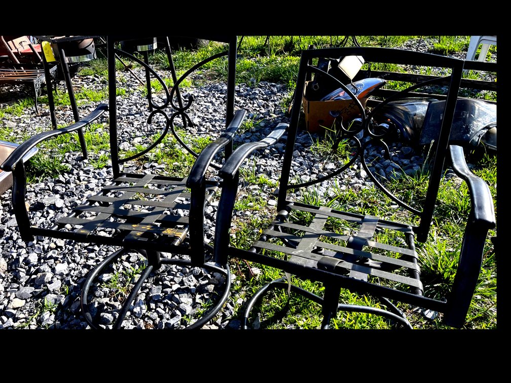 Two outdoor metal rocker chairs