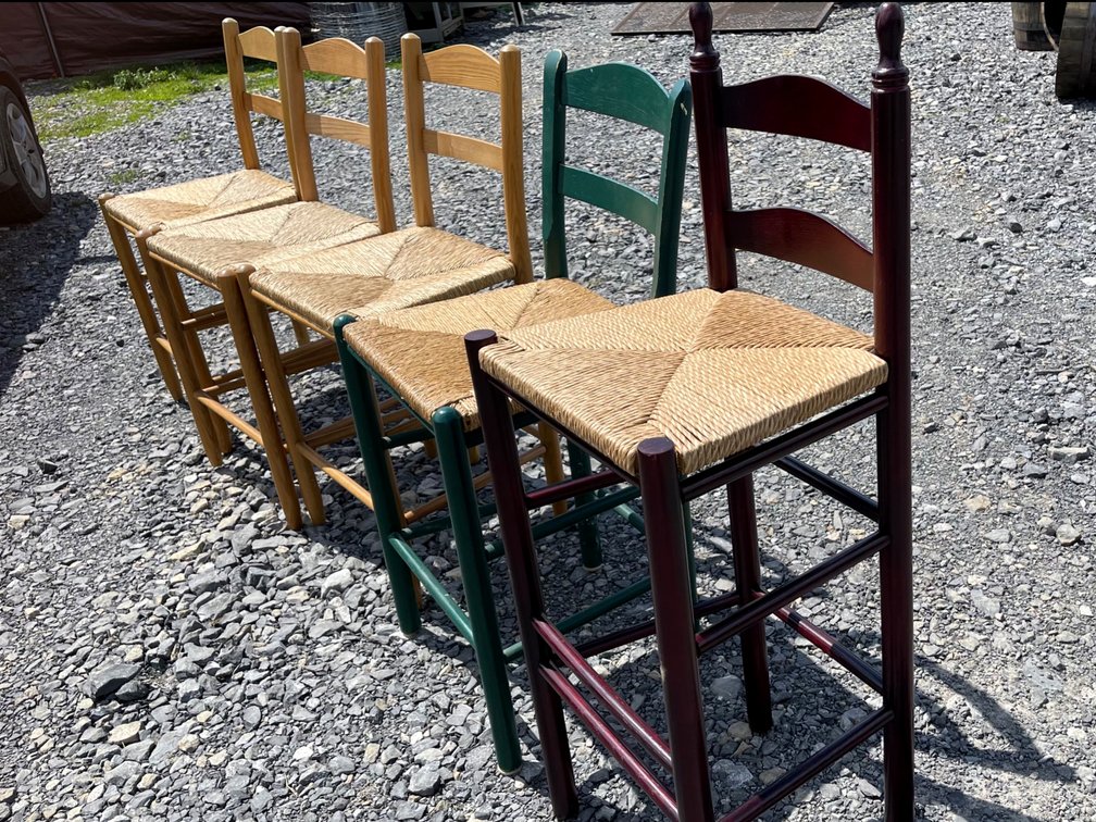 Five Ladderback farmhouse chairs with handwoven natural rush seats. Well kept and clean!