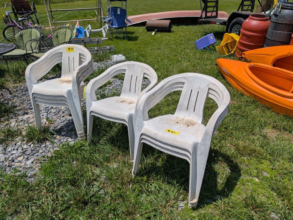 Nine Plastic Outdoor Chairs