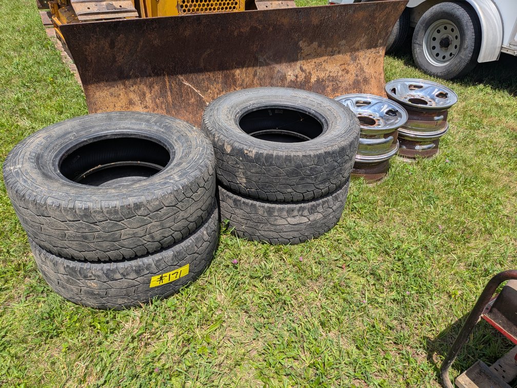 Four 16-inch Chrome Dodge Rims 8 x 6.5 Lug Pattern. And Four Tires (Tires do not fit these rims)
