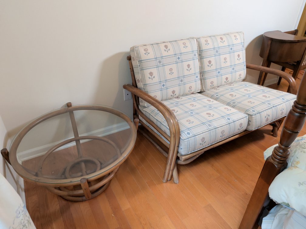 Rattan Loveseat and Glass-Top Coffee Table
