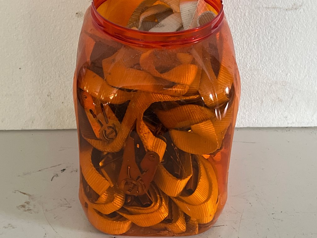Ratchet Tie-Down Straps in Plastic Storage Canister