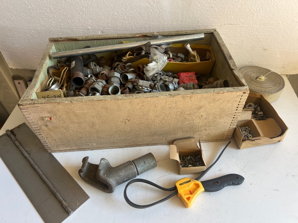 Pipe Fittings, Hardware, Strap Wrench, and Wooden Crate