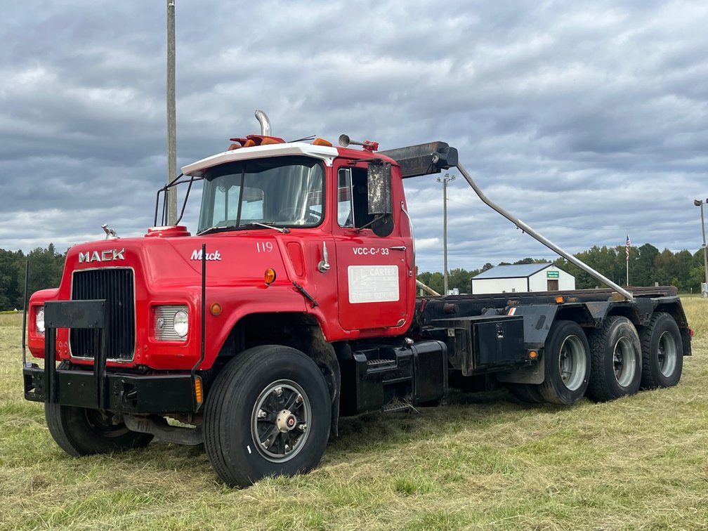 1986 Mack DM686S Conventional Cab Roll-Off Truck
