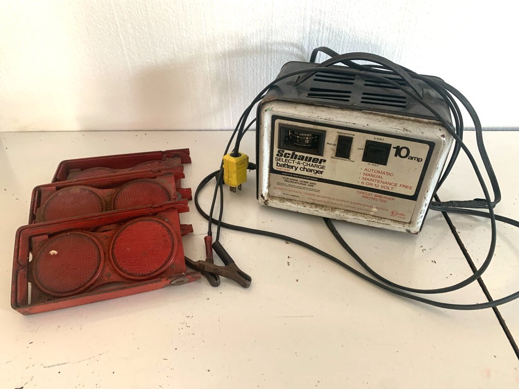 Schauer 10 amp solid-state battery charger10 Amp Battery Charger and Folding Roadside Warning Reflectors