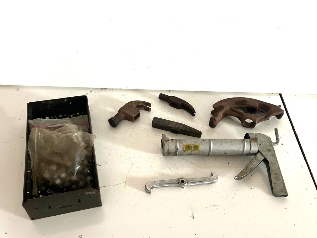 Caulking Gun, Conduit Bender Head, Hammer Heads, and More