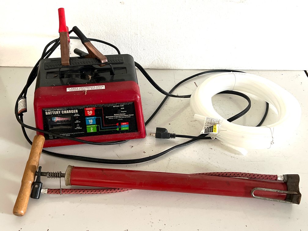 Battery Charger, Manual Air Pump, and Polyethylene Tubing