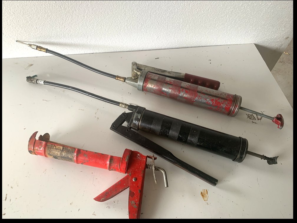 Two Lever-Action Grease Guns and Caulking Gun