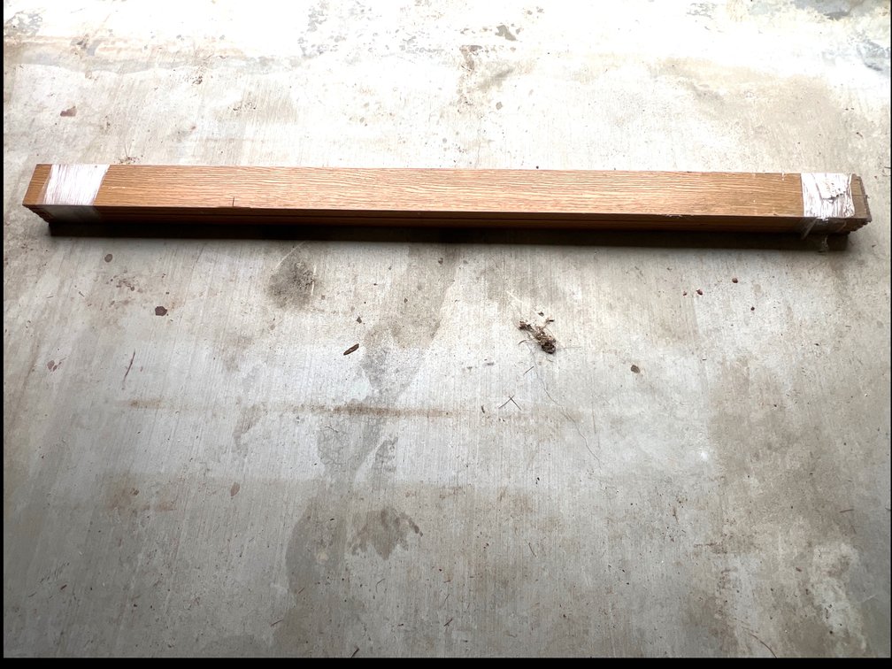 Bundle of Wood-Grain Trim Boards with Notched Ends