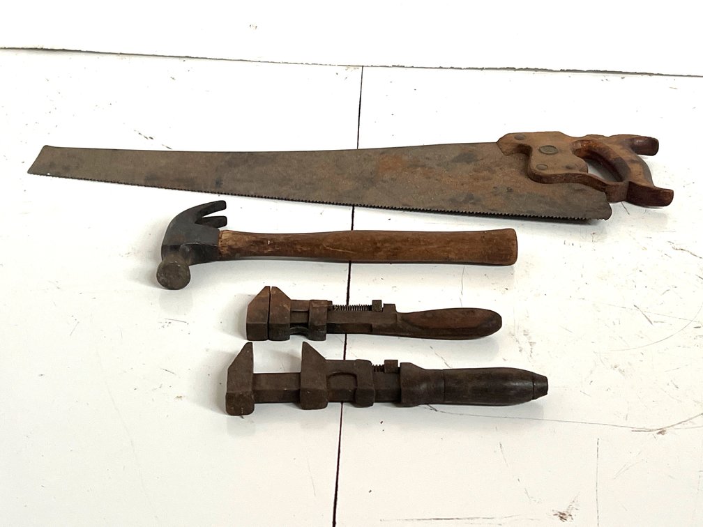 Steel Hand Saw, Claw Hammer, and Monkey Wrenches
