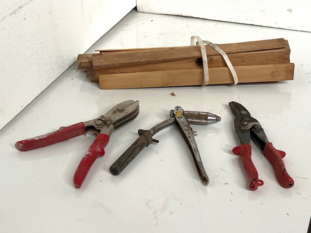 Tin Snips, Hand Riveter, and Bundle of Wood Shims