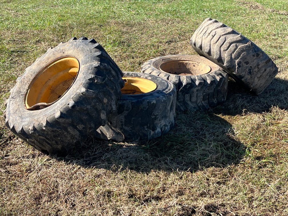 Four 12-16.5 Skid Loader Tires and Rims