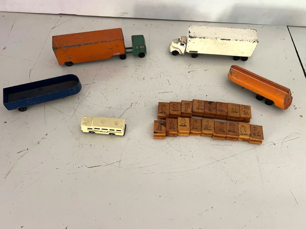Die-Cast Toy Trucks, Trailers, and Wooden Rubber Stamps
