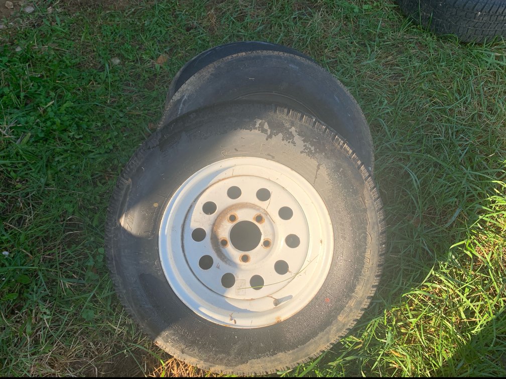 Three Tires Mounted on Steel Wheels