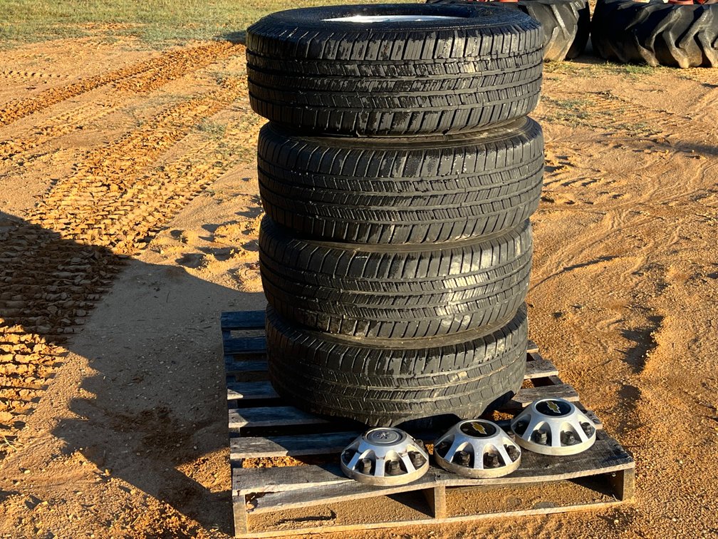Four LT265/70R17 Tires on 8-Lug Wheels with Center Caps