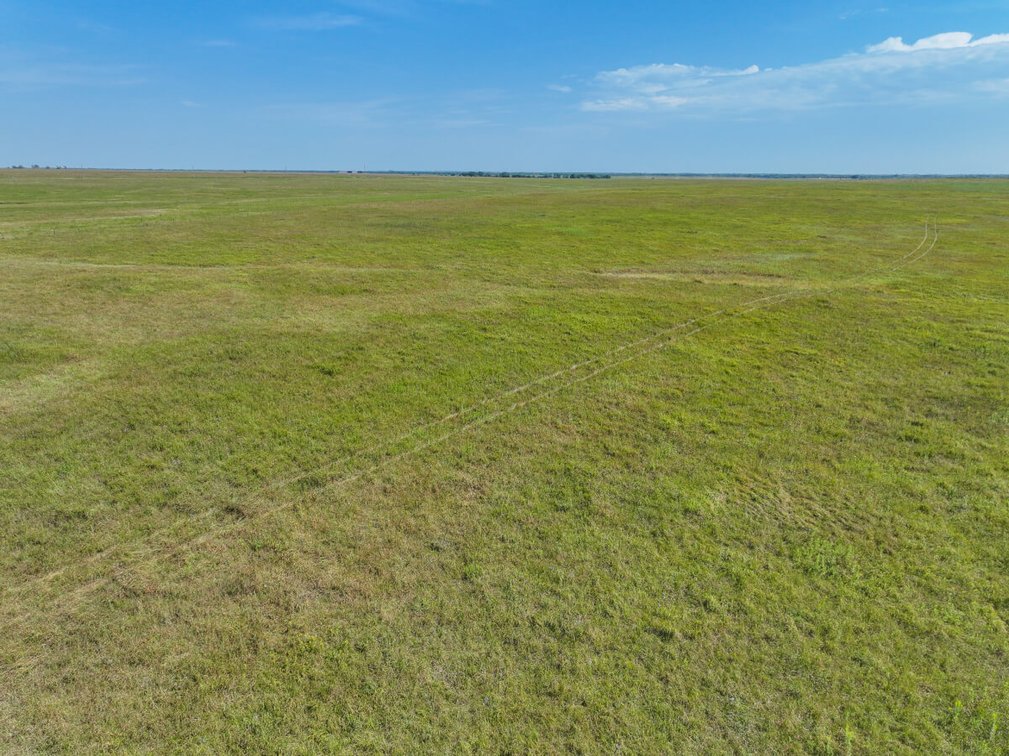 53.5 Acres of Native Pasture and a Large Pond near El Dorado Lake photo 5