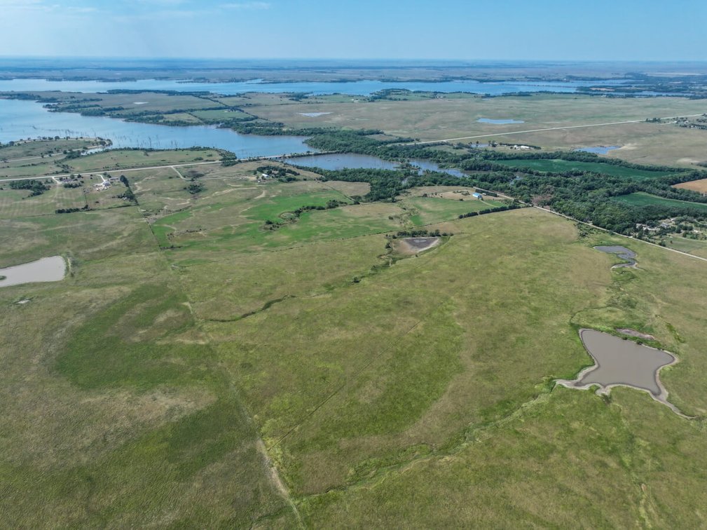 53.5 Acres of Native Pasture and a Large Pond near El Dorado Lake photo 9