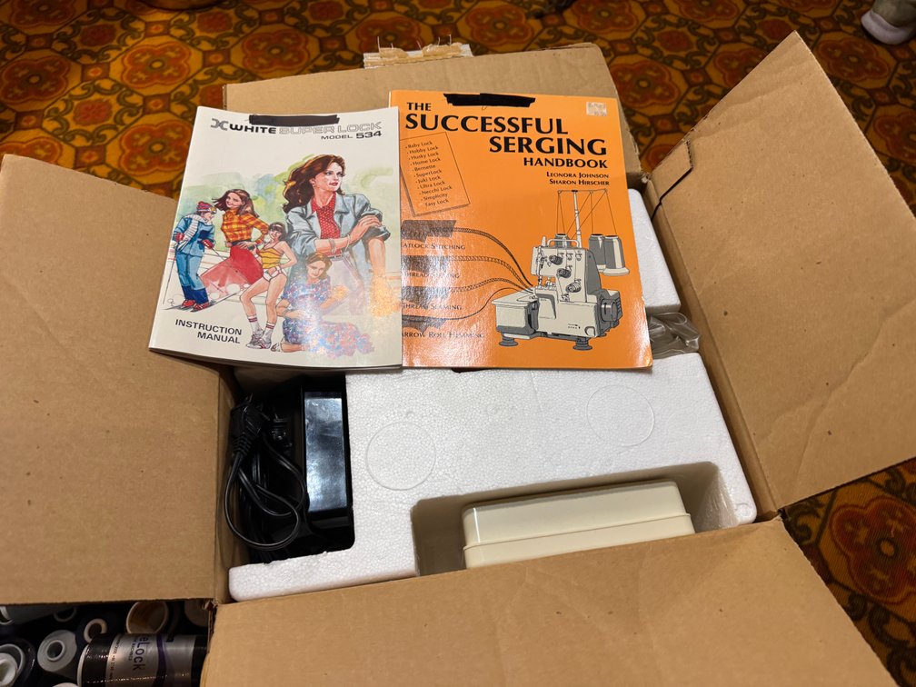 Super Lock Sewing machine and thread spools photo 2