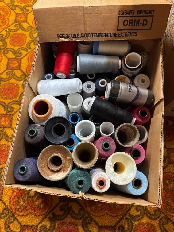 Super Lock Sewing machine and thread spools photo 3
