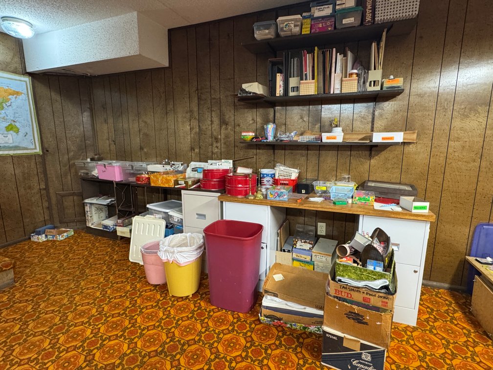 Contents of West Basement wall, Desks, Bookshelf's, beads, craft materials, Trash cans