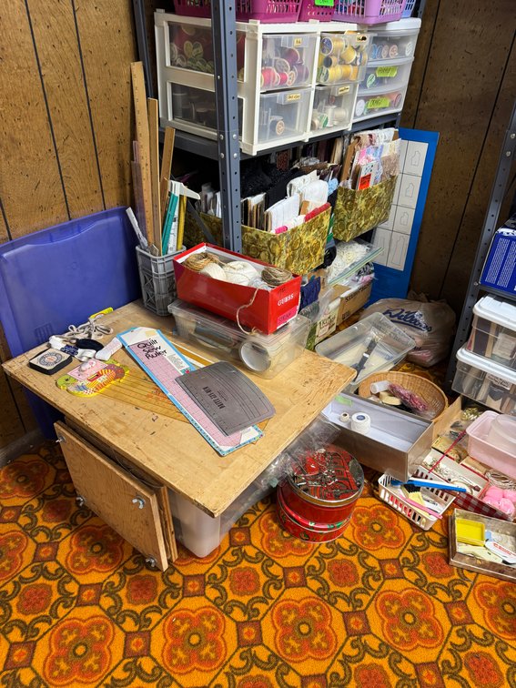 Contents of North basement wall, sewing, fabric, material, misc. craft materials, vintage treadle sewing machine stand- no top photo 2