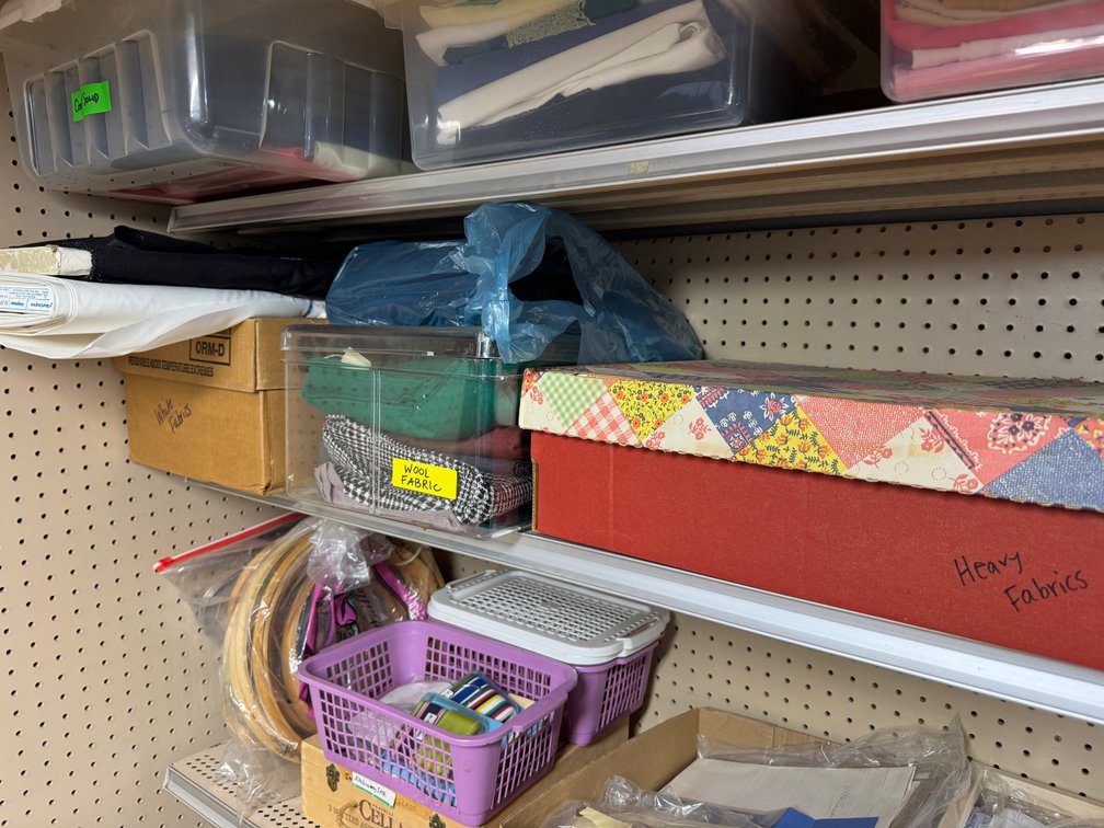 Contents of North basement wall, sewing, fabric, material, misc. craft materials, vintage treadle sewing machine stand- no top photo 11
