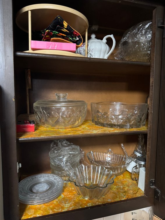 Glass serving dishes, contents of cabinet