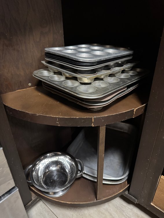 contents of lazy susan, drawers, and cabinet, pans, measuring, rags, etc. photo 2