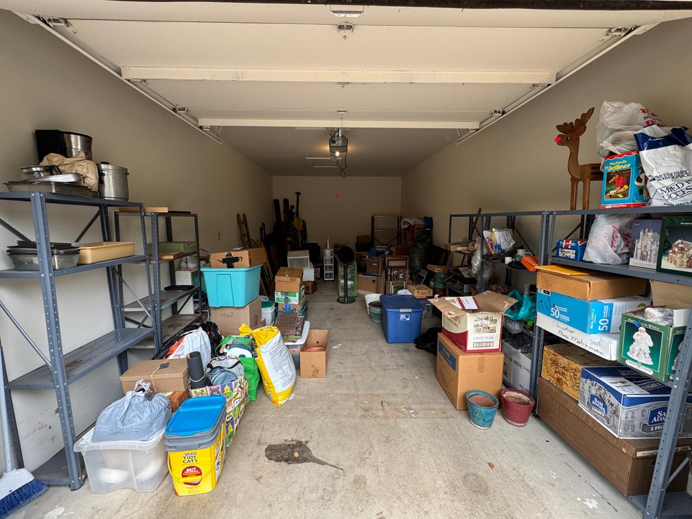 Contents of second garage, décor, tv, chairs, lamp, etc.