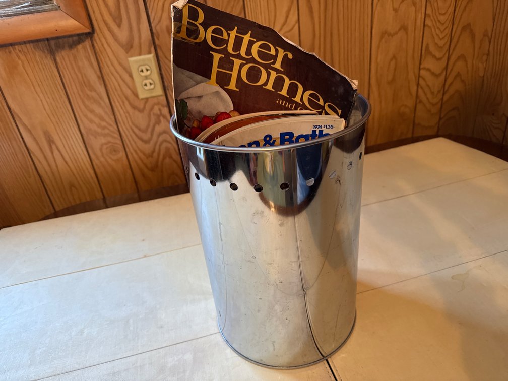 Metal Garbage Can with Magazines and Catalog