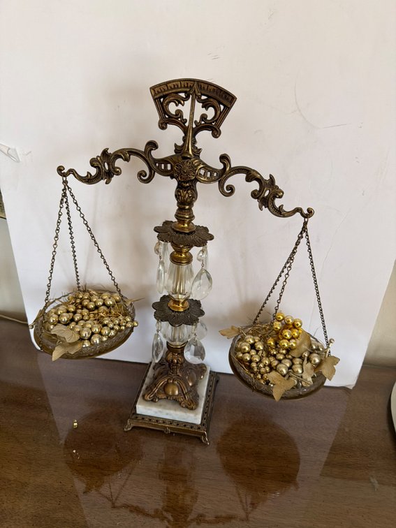 Vintage Scales of Justice piece is a decorative item featuring a gold-gilded bronze or brass structure with ornate scrollwork, foliage patterns, and dangling crystal teardrop prisms. 