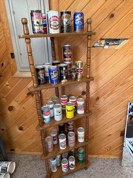 Shelf of Assorted Beer Cans- All are Opened From the Bottom