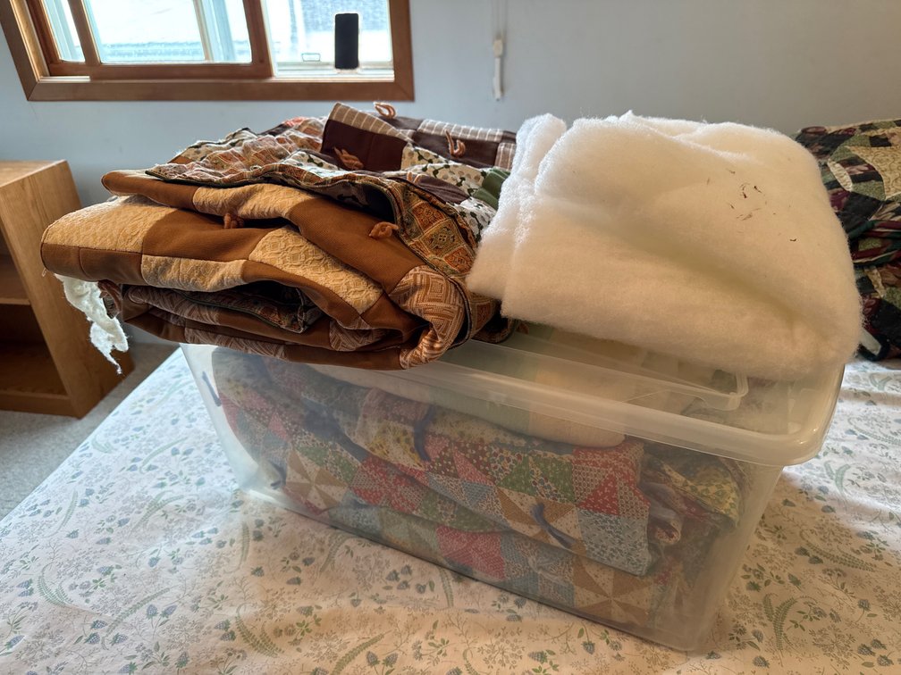 Tote of Assorted Quilts and Batting