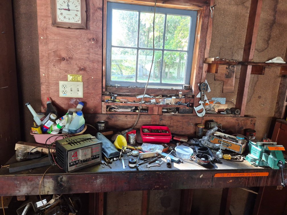 Contents On Table, Bench Vise Needs To Be Removed, Battery Charger and More