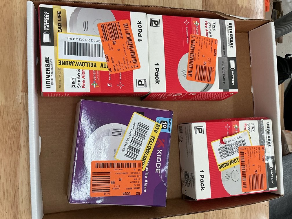 Three smoke detectors and two combo alarms