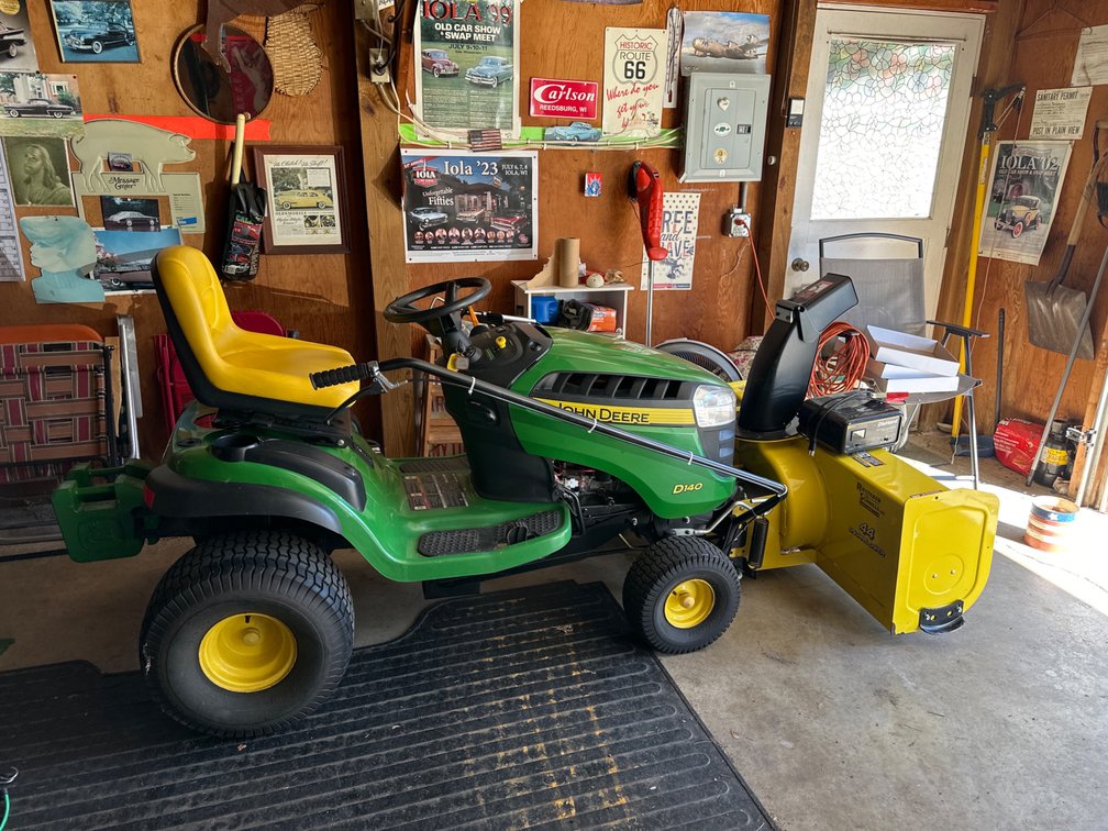 John Deere Lawn Mower with 48”  Mower Deck, Weights, and Snowblower Attatchment