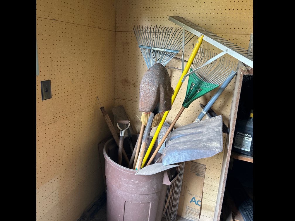 Garbage Can with Rakes, Shovels