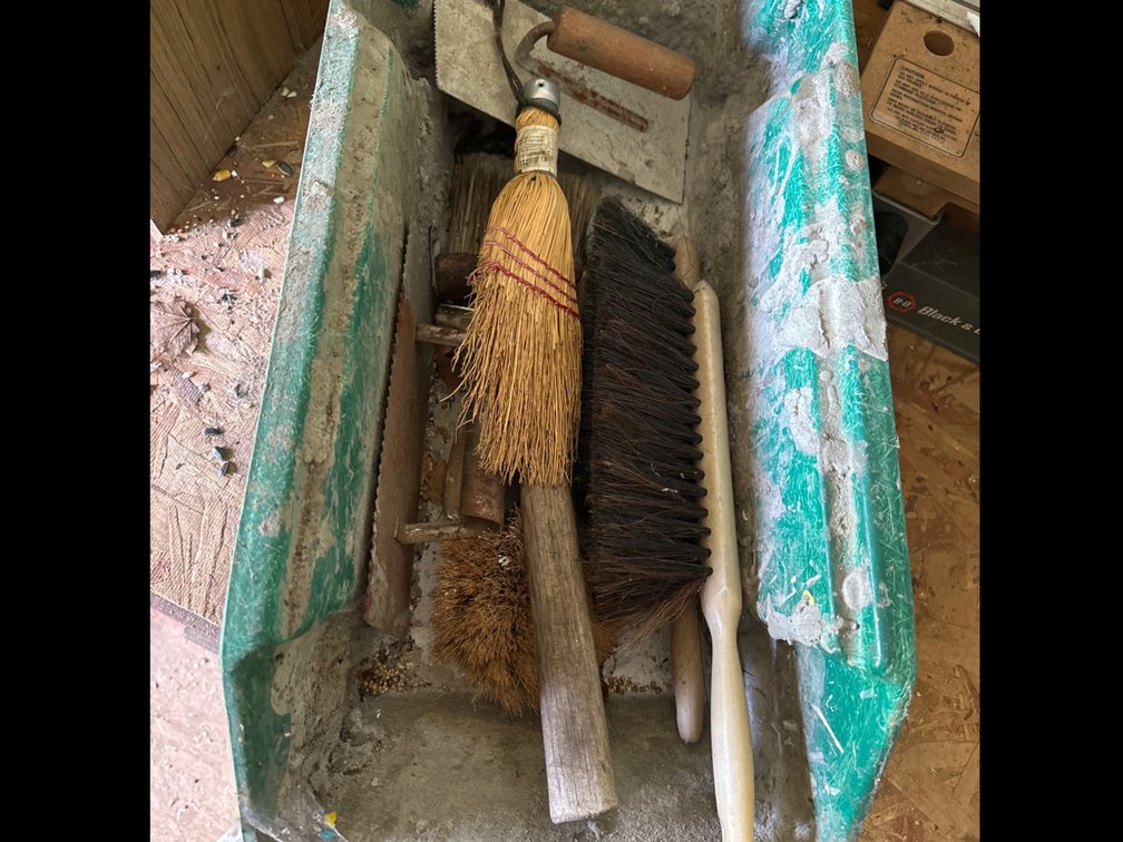 Tote with Brushes and Trowels