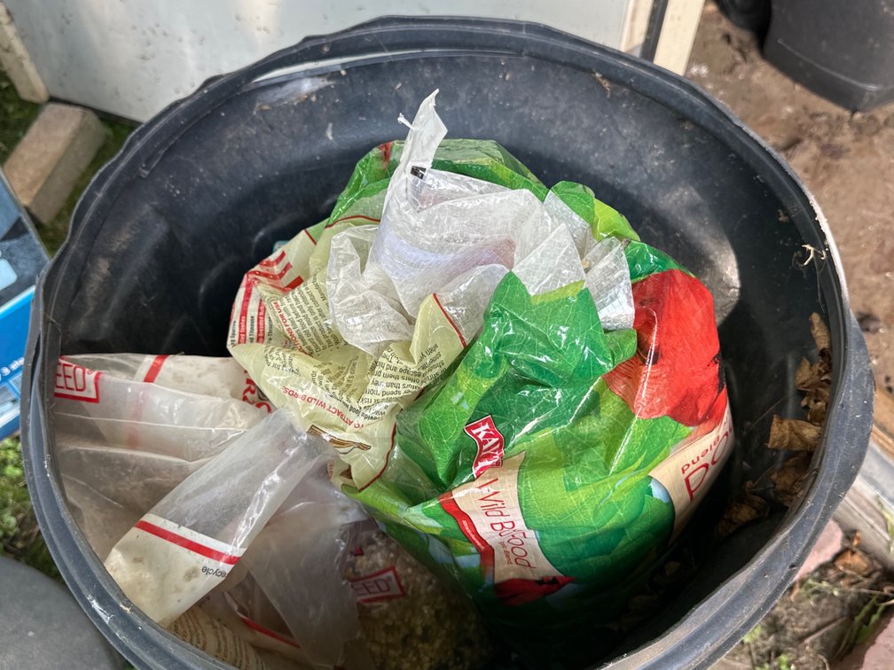 Garbage Can with Bird Seed