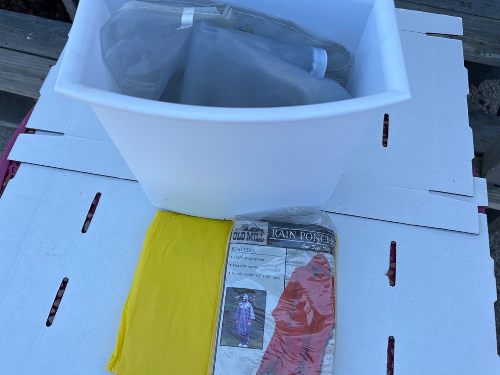 Garbage Bin with Rain Ponchos, Round Plastic